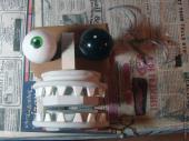 Cardboard puppet mouth with teeth and eyeballs